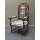 A 19th century carved oak high back elbow or throne chair