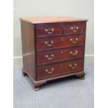 A Georgian style mahogany chest of two short over three long drawers on ogee bracket feet 76 x 69