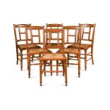 In the manner of E.W. Godwin, a set of six walnut dining chairs,