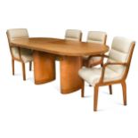 An Art Deco sycamore extending dining table and six chairs,