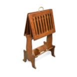 Liberty & Co., an Arts & Crafts oak 'Caxton' magazine rack, circa 1904,