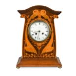 An Art Nouveau inlaid mahogany mantle clock,