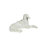 A Vienna porcelain blanc de chine model of a reclining Borzoi,