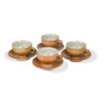 § § Gwyn Hanssen Pigott (1935-2013), a set of four porcelain cups and saucers,