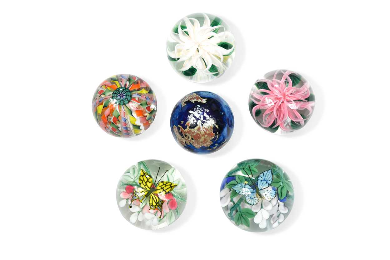 A group of six Lundberg Studio paperweights,