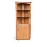 An Ercol elm corner cupboard,