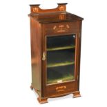 An Edwardian mahogany music cabinet with inlaid decoration,