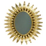 A mid-century gilt metal oval sunburst mirror,