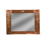 A Glasgow School copper framed wall mirror, circa 1900,