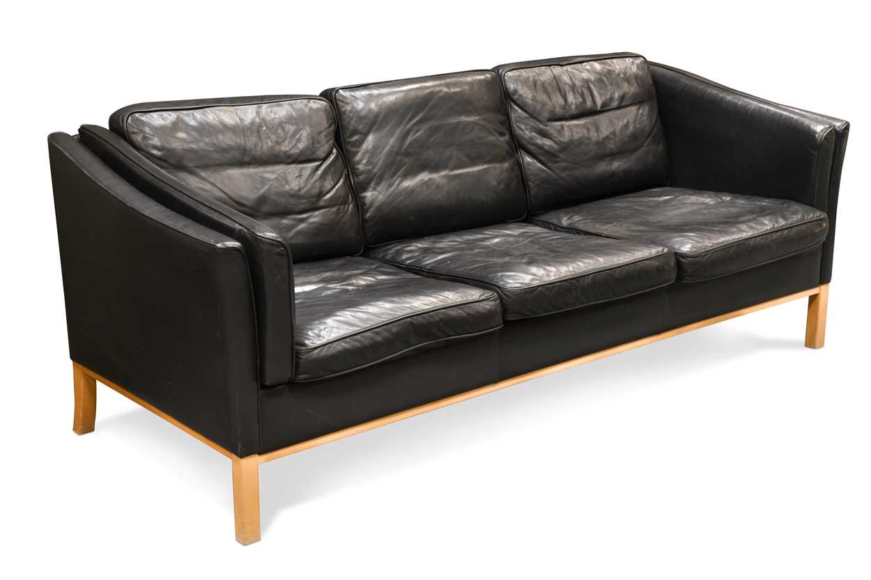 A Stouby style black leather three-seat sofa,