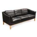 A Stouby style black leather three-seat sofa,