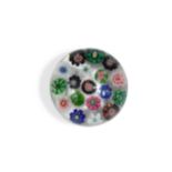 A small Clichy spaced millefiori glass paperweight,