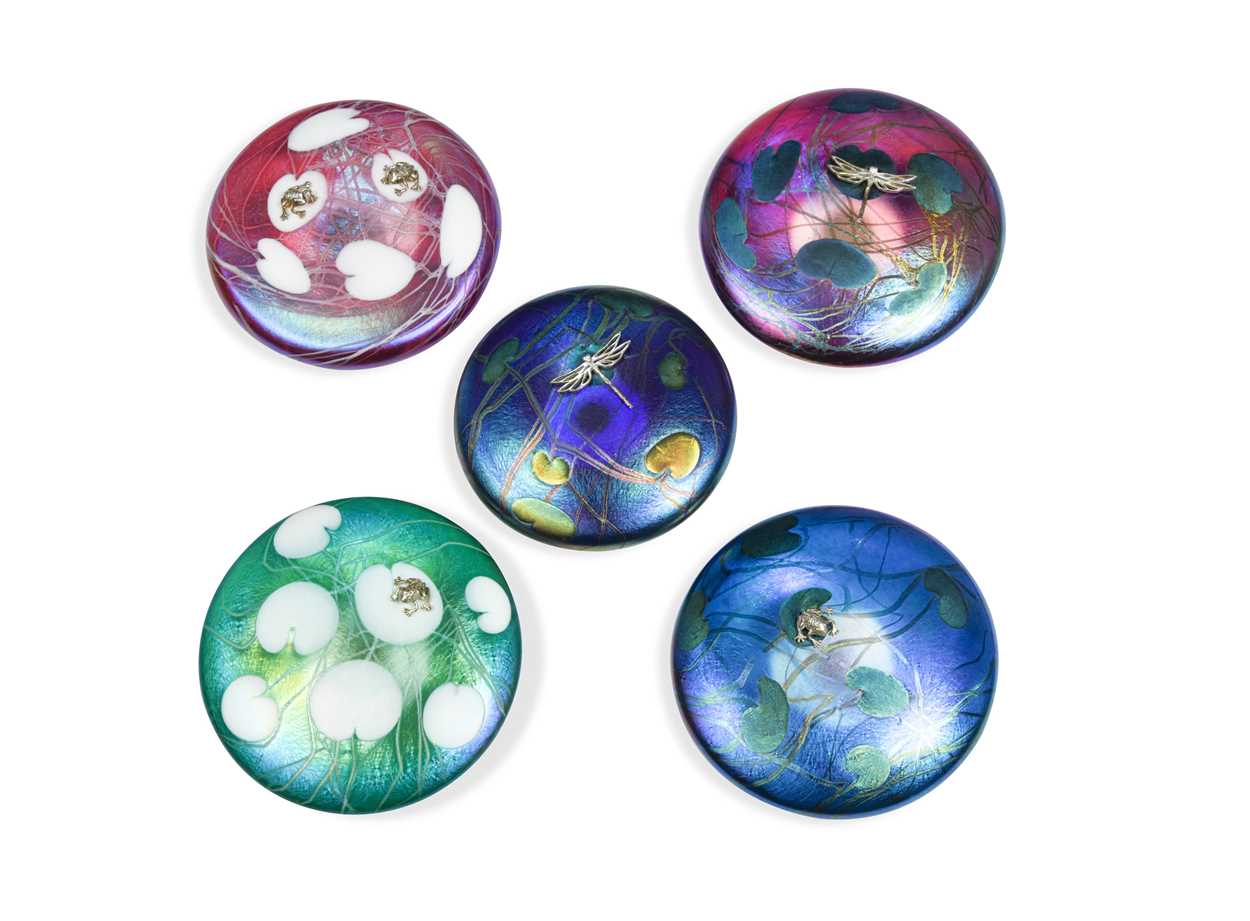 Five John Ditchfield iridescent glass paperweights,