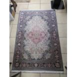 A modern Persian part silk rug, 190 x 123 and another similar rug 184 x 124 (both worn)