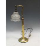 A 20th century brass desk lamp with shaped glass shade 51cm high