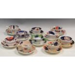 Ten 19th century Gaudy Welsh cups and saucers to include Village pattern, basket of flowers pattern,