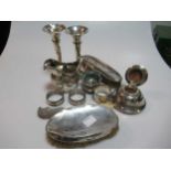 A collection of silverware including flatware, cream jug napkin rings, salt, a pair of loaded vases,