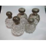 Two pairs of silver topped glass dressing table jars and another smaller example (5)