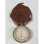 A lacquered brass cased circular pocket compensated barometer by Cooke, Troughton & Simms Ltd, no.