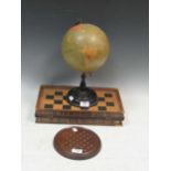 A Philips British Empire globe on black wood stand and solitaire board and folding leather