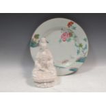 An 18th century Chinese famille rose plate and a blanc de chine figure