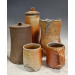A collection of 20th century pottery to include a utensil jar, vases and mugsCondition report:
