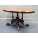 A Victorian figured walnut and inlaid oval loo table, on carved pedestal support and 4 legs 73 x 142