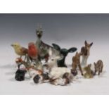 Five Royal Doulton porcelain models of cats, a Royal Dux model of a goat, other models of animals