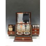 An inlaid drinks compendium box, some alterations, with three decanters and various fittings