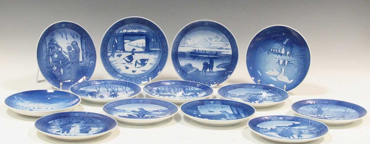 A collection of Royal Copenhagen ceramic plates, including 'The Queen's Christmas Residence'