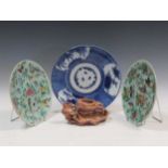Pair of Chinese celadon glazed dishes, enamalled with birds and butterflies; a sopastone carving,