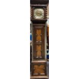 An oak longcase clock, the hood with dentil cornice and split turned columns, the eight day striking