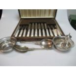 A pair of silver bon bon dishes, a cased set of six silver teaspoons with enamel decoration, a cased