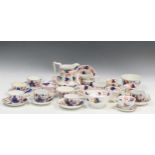 A collection of 19th century Gaudy Welsh ceramic tea wares with pink lustre rims to include teacuops