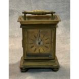 A 19th century brass carriage clock with a watch movement, signed by Andrew Flockhart, 13.5cm high