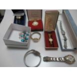 A collection of costume jewellery and watches