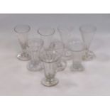 Four George III wyrthen ale/jelly glasses, an hexagonal jelly glass and three other jelly/ale