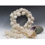 A shell wreath, coral and an amethyst geode