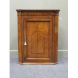 A George III inlaid oak corner cupboard 103 x 82 x 48cm