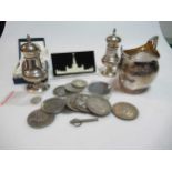 A silver cream jug and a pair of silver peppers, 6.8ozt gross, together with some coins, two