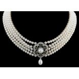 A five row cultured pearl choker with diamond and emerald centrepiece,