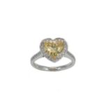 An 18ct gold fancy intense yellow diamond halo style ring,