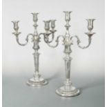 Two George III silver candlesticks with a pair of later 3 light branches,