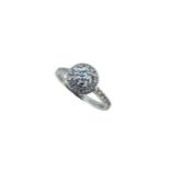 A diamond halo style cluster ring,