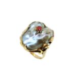 A baroque pearl and garnet ring,