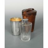 An early 20th century silver plated travelling cup with glass flask,