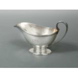 An American metalwares silver sauce boat, mark of Tiffany,