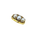 An ornate pearl ring,