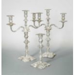 A pair of Victorian silver three light metamorphic candelabra, with a matching single candlestick,