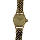 Omega - A 9ct gold wristwatch on a later 9ct gold bracelet,